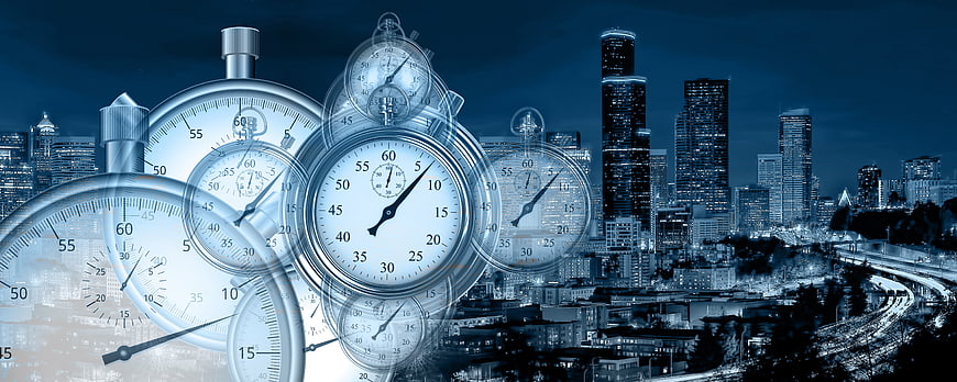 Blue stopwatch clocks overlaid on city skyline at night