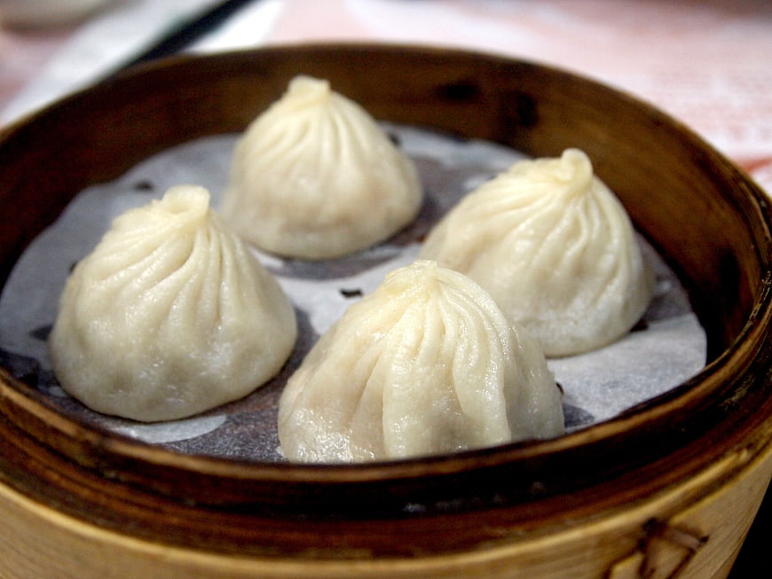 Steamed soup dumplings in bamboo steamer
