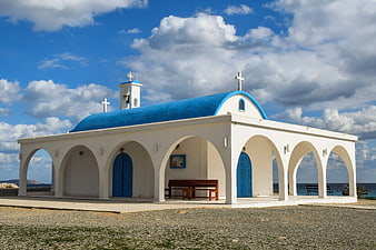 White and Blue Greek Orthodox Church by the Sea