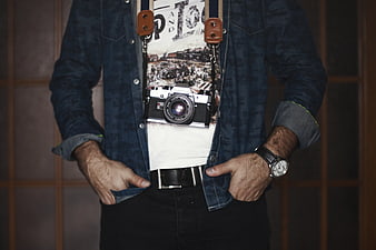 Man with Vintage Camera and Denim Jacket