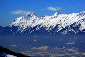 Snow-Capped Mountain Range with Valley View