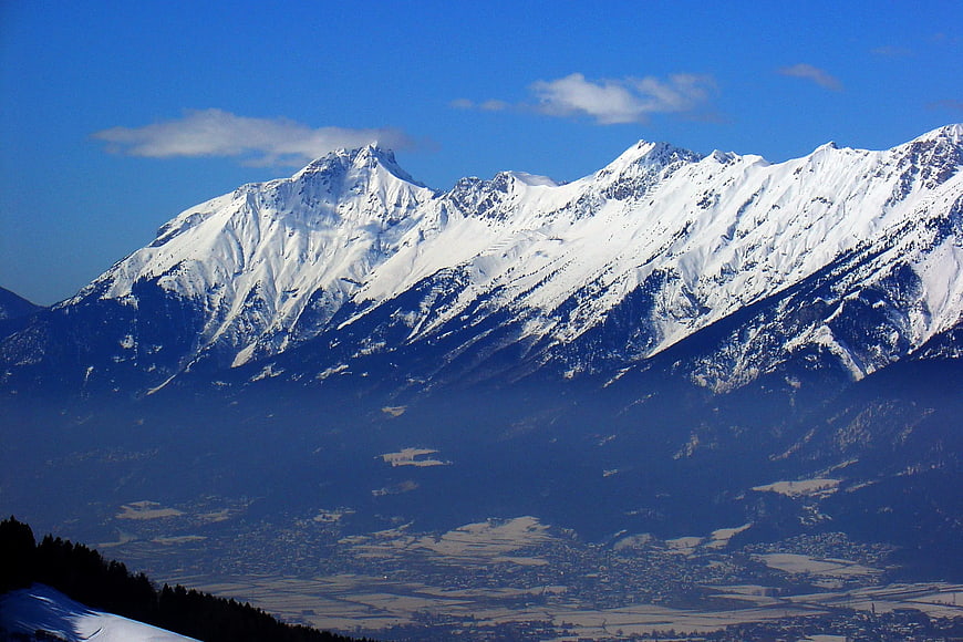 Snow-Capped Mountain Range with Valley View