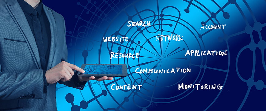 Businessman Using Tablet With Digital Network Diagram And SEO Keywords