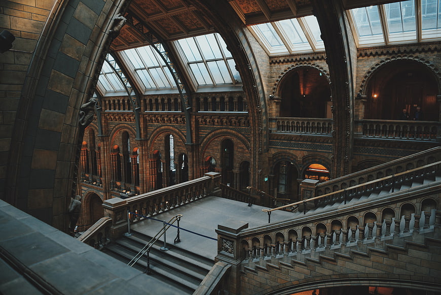 Grand Victorian Museum Interior with Arched Staircase