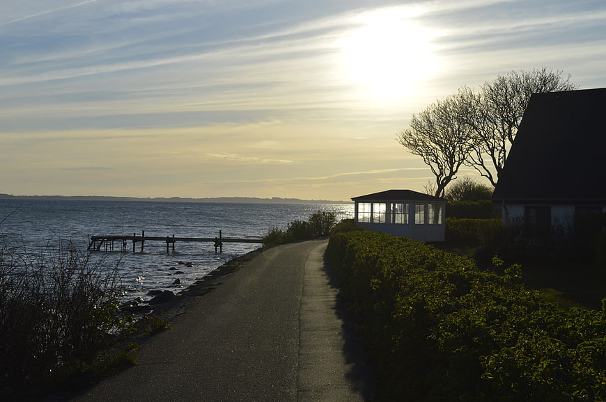 Coastal Road at Sunset with House and Sea View