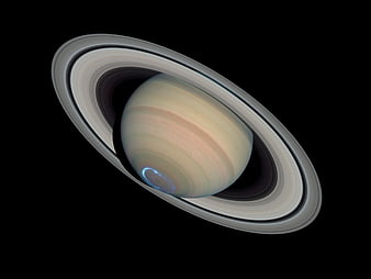 Saturn with rings and aurora borealis in space