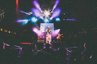 Live Concert Performance with Stage Lights and Crowd