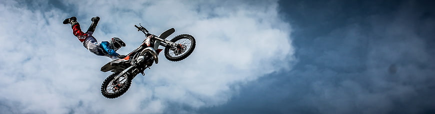 Motocross Rider Performing Freestyle Stunt in Mid-Air