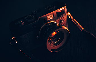 Vintage Leica Camera with Minolta Lens in Moody Lighting