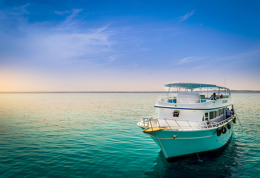 White Tour Boat Anchored in Turquoise Red Sea Waters