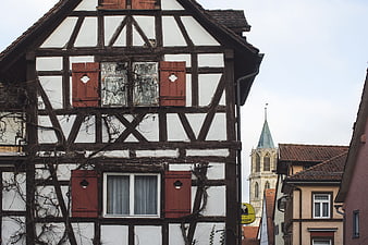 Traditional German Half-Timbered House with Church Spire