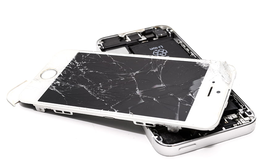Broken White Smartphone With Cracked Screen And Exposed Internal Battery