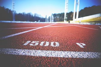 Close-up of 1500m mark on red running track