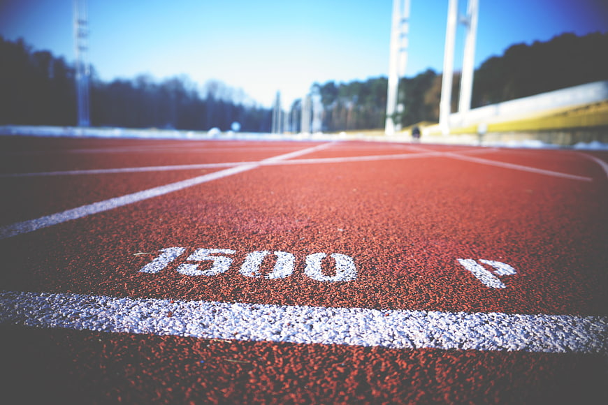 Close-up of 1500m mark on red running track