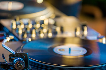 Close-up of vinyl record player with bokeh background