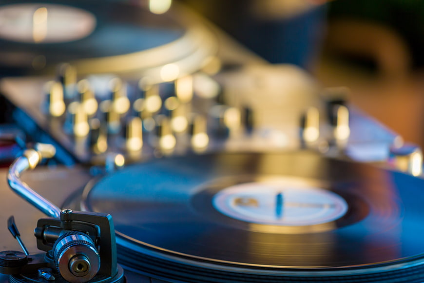 Close-up of vinyl record player with bokeh background