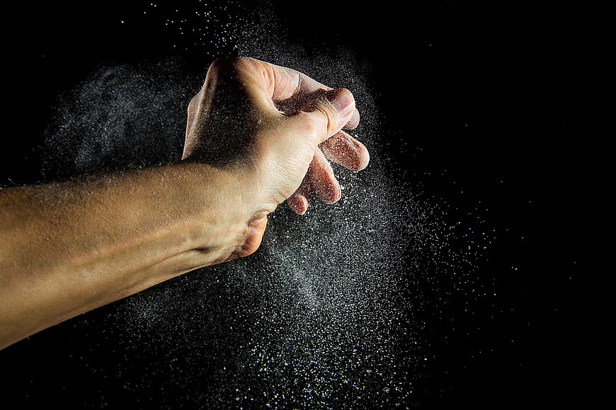 Hand Clapping Flour Dust in Slow Motion