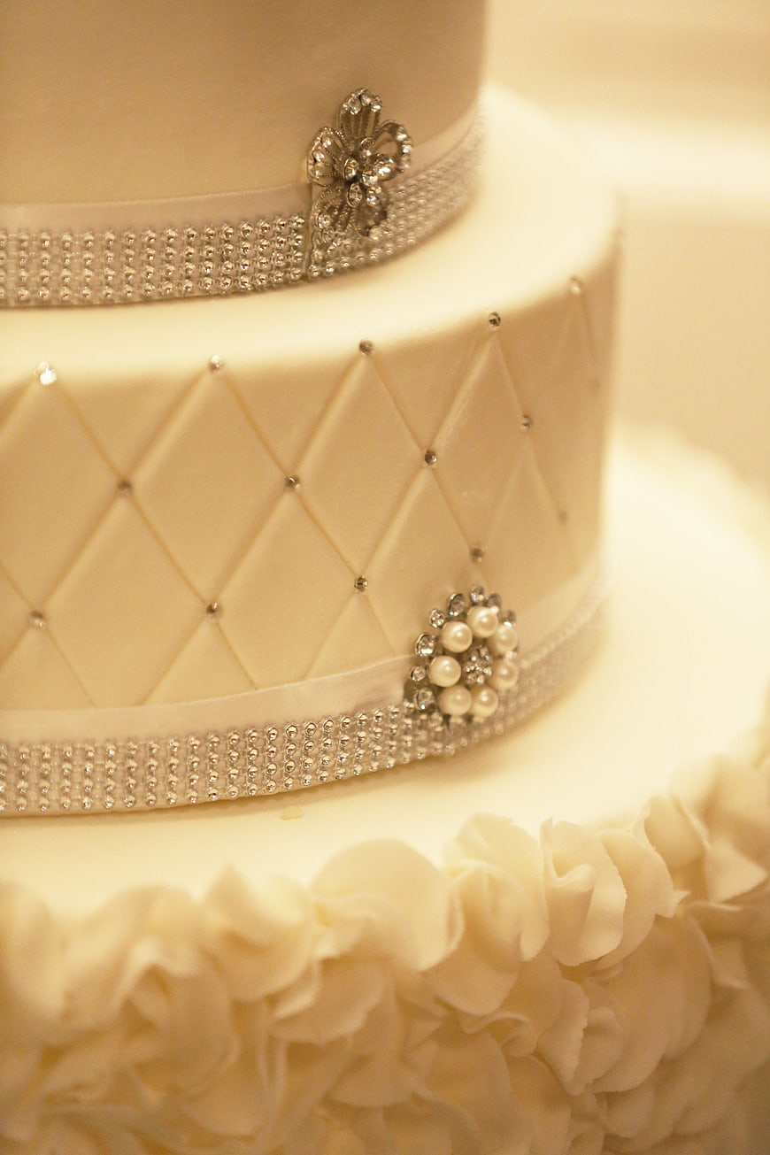 Elegant White Wedding Cake With Pearl And Crystal Decorations
