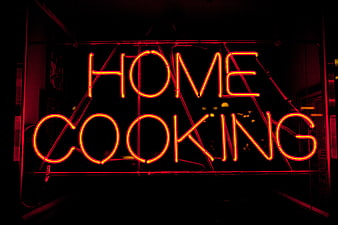 Red Neon Home Cooking Sign in Dark Setting