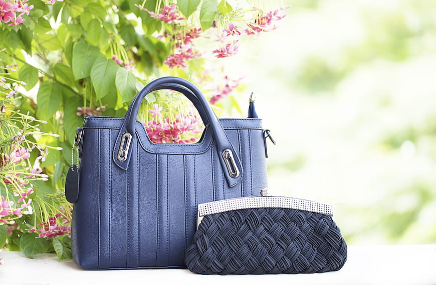 Blue Leather Handbag and Woven Clutch with Flowers