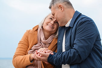 Happy Senior Couple Embracing Outdoors