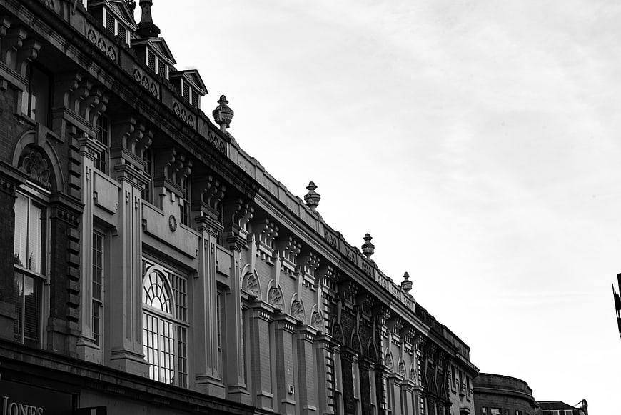 Black and white low angle view of historic Victorian architecture