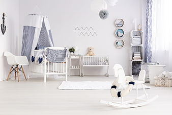 Bright Nautical Nursery Interior With White Furniture And Blue Accents