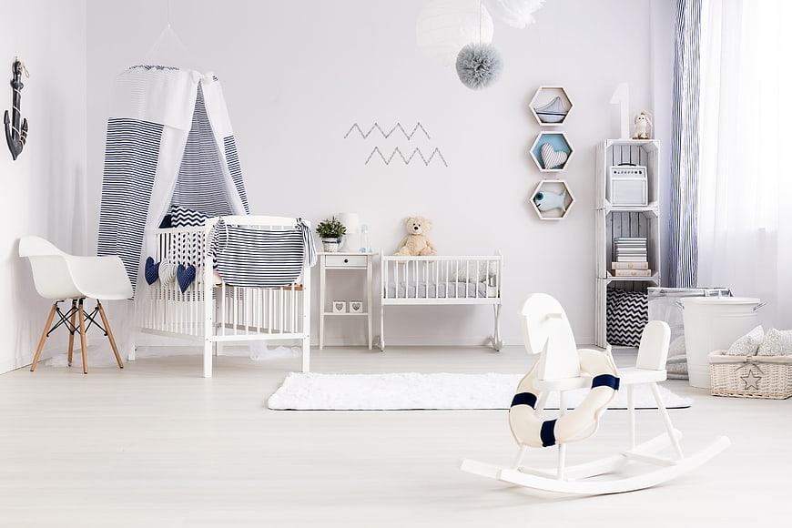 Bright Nautical Nursery Interior With White Furniture And Blue Accents