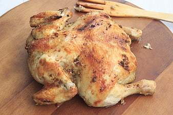 Whole Roasted Chicken on Wooden Board