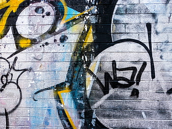 Abstract Graffiti Art on Weathered Brick Wall