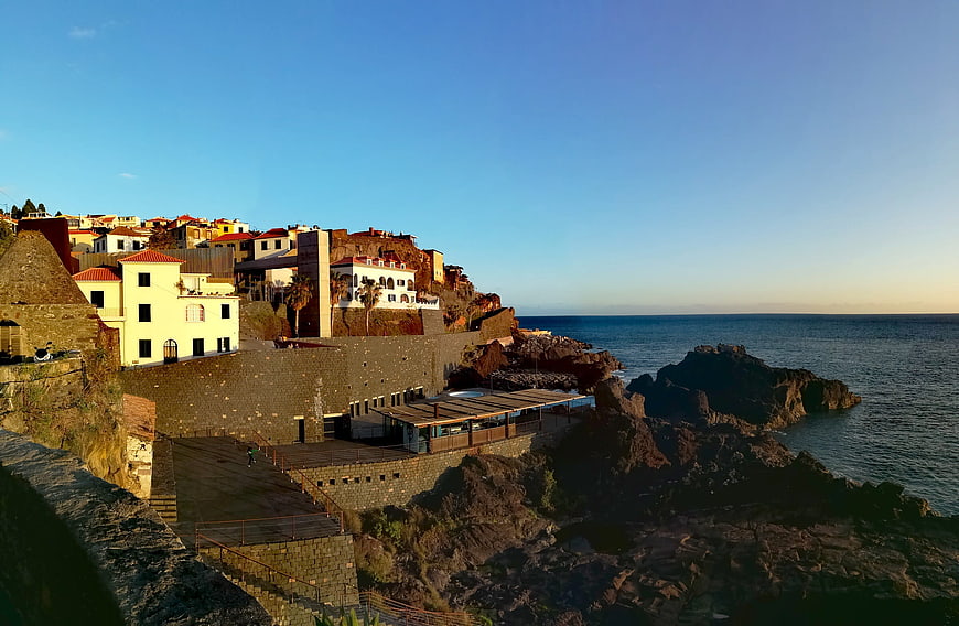 Coastal village architecture on rocky cliffs overlooking the ocean