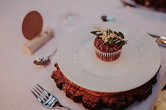 Rustic Wedding Cupcake on Wooden Slice with Greenery