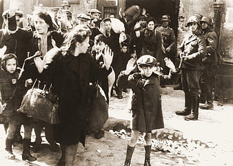Historical Black and White Photo of Warsaw Ghetto Residents with Hands Raised