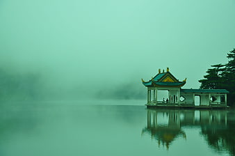 Traditional Chinese Pavilion on Misty Lake at Dawn