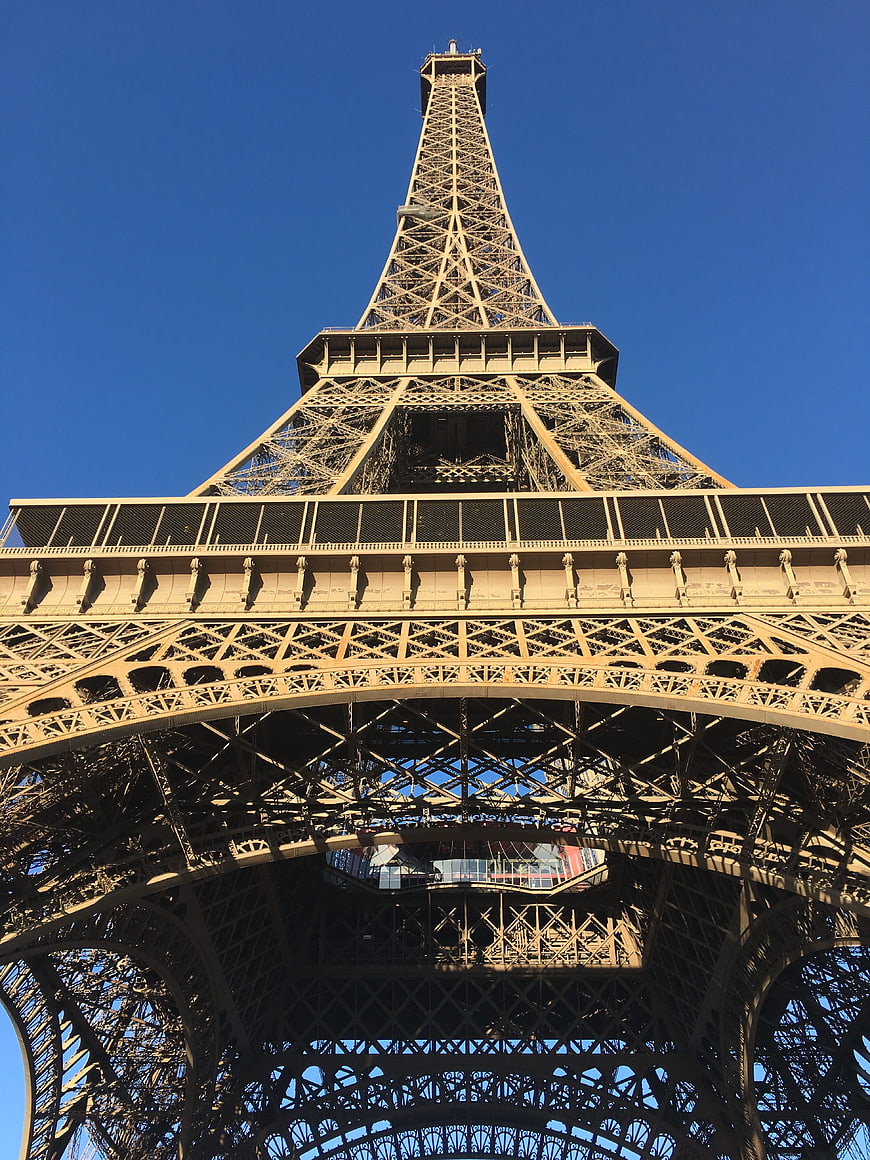 Low Angle View of Eiffel Tower Lattice Structure Against Blue Sky
