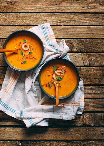 Top View of Vegan Pumpkin Soup on Rustic Wooden Table