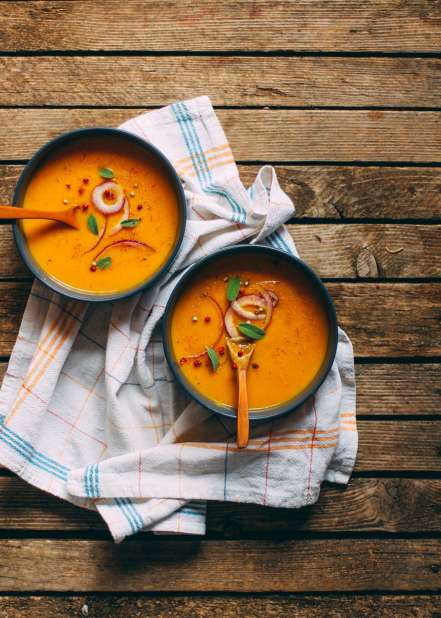 Top View of Vegan Pumpkin Soup on Rustic Wooden Table