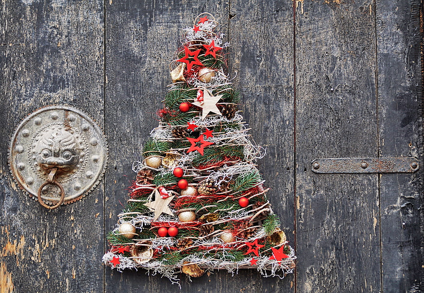 Rustic Christmas Tree Decoration on Old Wooden Door