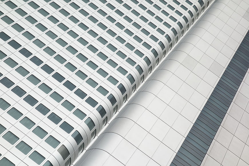 Modern White Office Building Facade with Grid Windows