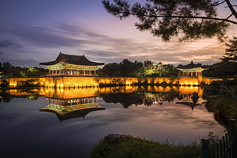 Traditional Korean Pavilion Reflection in Pond at Dusk