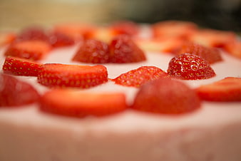 Close-up of fresh strawberry cake with creamy frosting