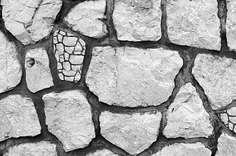 Black and white stone wall texture with mosaic detail
