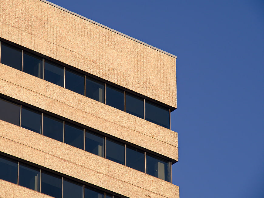 Modern Office Building Facade Against Blue Sky