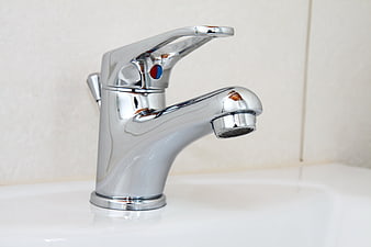 Chrome Bathroom Faucet On White Sink