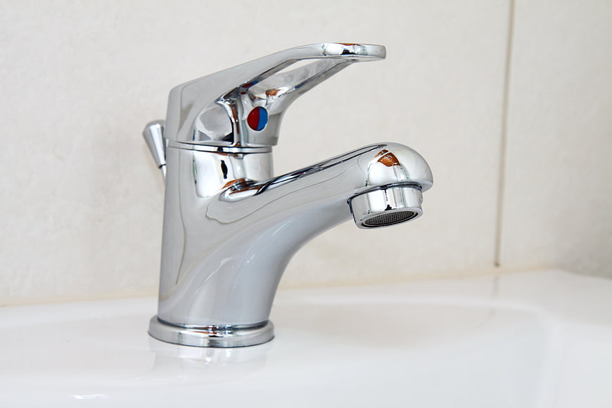 Chrome Bathroom Faucet On White Sink