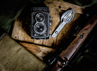 Vintage Rolleiflex Camera and Utensils on Wood