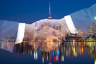 Double Exposure Business Handshake Over Toronto Skyline at Night