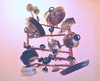 Vintage Kitchen Utensils Hanging on Wooden Rack