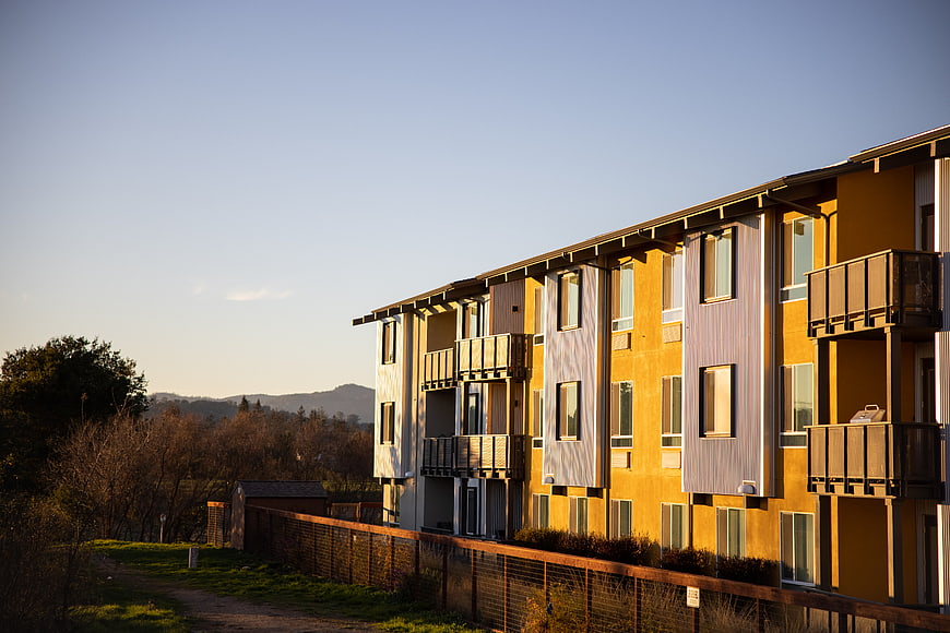 Modern Yellow Apartment Building at Sunset