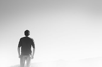 Lonely Man Standing In White Misty Landscape Black And White
